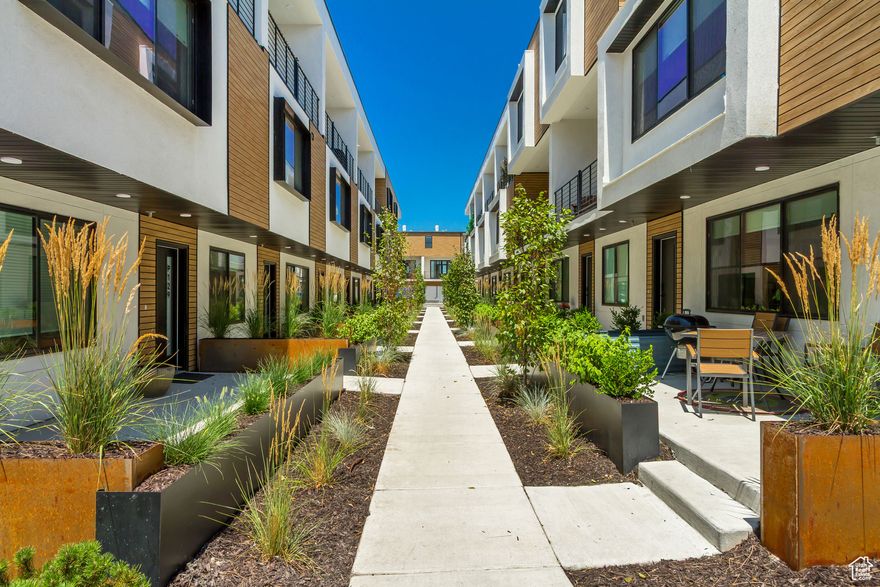 Price reduced!!!  Quick Move In Special Pricing!  Experience the perfect harmony of modern comfort and environmental stewardship. Opus Green Townhomes offer a range of floor plans, including 2- and 3-bedroom townhomes, designed with meticulous attention to detail. From the spacious great rooms and gourmet kitchens to the tiled bathrooms and open stair railings, every aspect of Opus Green exudes sophistication and elegance for your comfort. This modern townhome community is all-electric with 9'7" cathedral ceilings, tiled showers and tubs with glass doors. Best in class, Pella windows, ductless, wall-mounted mini split air conditioners and heat pumps.  Quartz countertops and a one of a kind floorplan not seen before. This 2 bed 2.5 bathroom oasis will leave you green with envy. The garage with EV charging station, 1 touch smart home temperature control app and package storage/delivery service "Fetch Package", are just a few more added benefits to this zero emission environmental living townhome. Embrace a life of unparalleled comfort, elegance and fulfillment in the dwelling you've been longing for.  Preferred lender incentive, 3% down conventional loan, no Mortgage Insurance, reduced lender fees.  Ask us for more details.