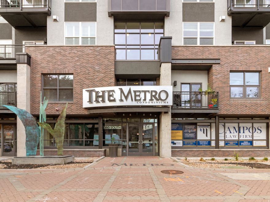 Enjoy vibrant downtown living in this spacious, upgraded one-bedroom condominium located within close proximity to movie theaters, dining, nightlife, the City Library, and numerous urban conveniences. This large one-bedroom unit features wood flooring, custom lighting, modern built-in floor to ceiling shelving, and an upgraded kitchen. The unit is equipped with Google Fiber internet service with speeds up to 1 Gbps.  Additional features include one indoor parking space in a secure, resident-only garage, as well as a private, lockable storage locker. The pet-friendly building offers an outdoor dog run and is a newer, security-focused development with controlled access. Residents enjoy access to exceptional common amenities, including a beautifully landscaped courtyard with barbecue grill, a fully equipped fitness center, and a spacious common room with TV suitable for gatherings or relaxation. This property offers an ideal blend of modern upgrades, building amenities, and walkable downtown convenience. Perfect for buyers seeking a low-maintenance 'lock and leave' home in a highly desirable urban location.