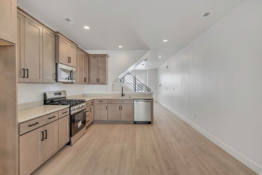 The Wait is Over! Newly Released Manhattan Floor Plan in the New Downtown Daybreak Area and just a Short Walk to the Bee's Ballpark! This 2 Bed 1.5 Bath + Flex Room has 9 ft. Ceilings on all Floors, Electric Fireplace and Open Railing for an Elevated and Luxury Feel.  Home is Complete and Ready for Quick Move-In!!