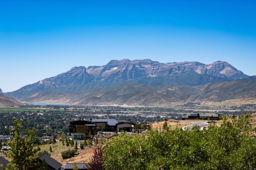 Perched in a prime, easily accessible location within the prestigious Red Ledges community, this exceptional 1.54-acre homesite offers unobstructed, sweeping views of the Heber Valley, Mount Timpanogos, and Deer Valley. Surrounded by the natural beauty of the Wasatch Back, this lot provides the perfect canvas to build your dream home. Enjoy full access to world-class amenities, including a Jack Nicklaus Signature Golf Course and short course, equestrian center, tennis and pickleball courts, two swimming pools, a clubhouse, and two on-site restaurants. Ownership also includes premiere access to Deer Valley Resort through Red Ledges' exclusive ski program, private ski shuttle, and dining privileges. Don't miss this rare opportunity to own one of the most scenic and desirable homesites in Red Ledges.