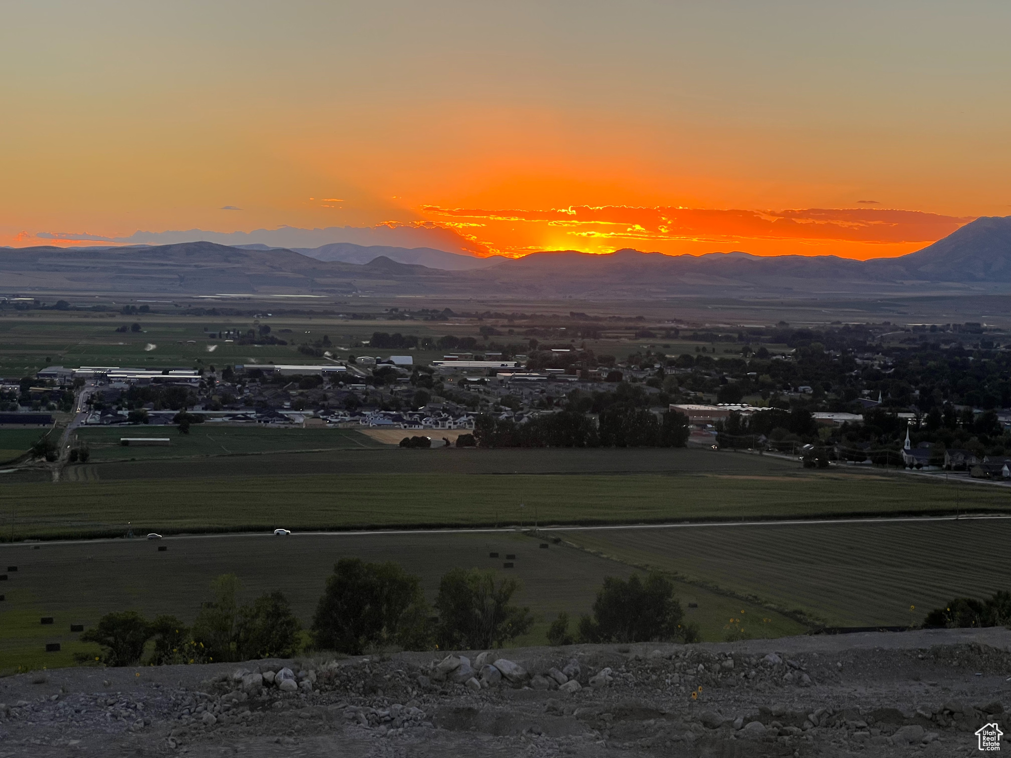 Dont miss the opportunity to own this stunning .7-acre view lot! Enjoy breathtaking panoramic views of the valley below and the majestic Wellsville Mountain Range in the distance. Situated next to a charming horse pasture, this exceptional property offers the perfect balance of serene country living and easy access to city conveniences. The lot also provides the option to terrace the yard, creating space for a future pool and pickleball court. Additionally, the seller has plans and a bid for an incredible home and is willing to include them if interested. Stubbed and ready for your dream home.  Agent is related to the seller.