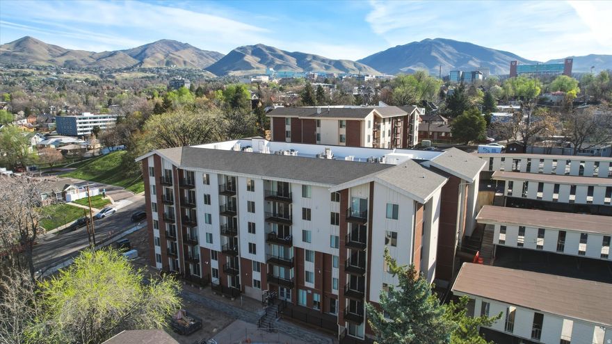 Completely rebuilt and thoughtfully upgraded, this stunning end-unit condo offers the look and feel of new construction-without the wait. The beautifully designed kitchen features quartz countertops, custom cabinetry, stainless steel appliances, and a sleek modern tile backsplash, all opening seamlessly into a bright, open-concept living and dining space with warm, updated flooring throughout. Ideally located near the University of Utah, downtown Salt Lake City, shopping, dining, TRAX, and endless outdoor recreation, this home combines convenience with modern living. Residents enjoy access to a shared laundry facility, covered parking, indoor spa, and outdoor pool. The building is fiber-wired for high-speed connectivity, and the HOA offers additional storage options for rent. With no rental cap, this property also presents an excellent investment opportunity. A rare chance to own a fully turnkey condo that truly stands out.