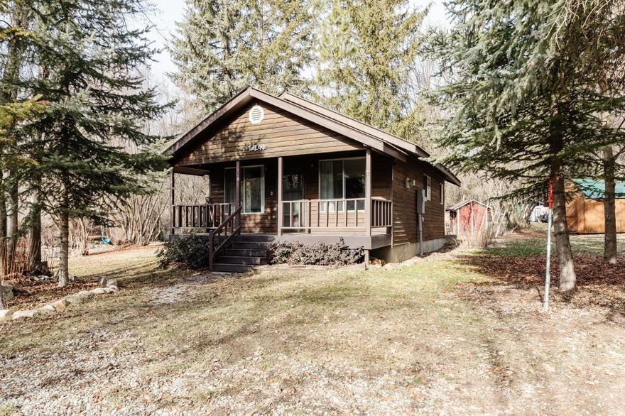 Escape to nature with this charming 1-bedroom/1-bath RIVERFRONT cabin nestled along the Cub River in a beautifully wooded setting. Designed for recreational use, this cozy retreat offers the perfect place to unplug and unwind while enjoying the sights and sounds of the river just steps away. Inside, you'll find granite countertops, durable LVP flooring throughout, an on-demand water heater, and a warm propane fireplace for year-round comfort. Ideal for weekend getaways, or a peaceful basecamp for outdoor adventures, this property delivers rustic charm with modern finishes in an unbeatable natural setting.