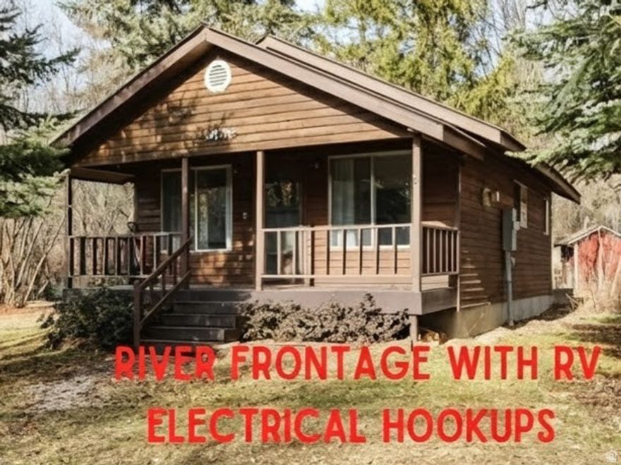 Escape to nature with this charming 1-bedroom/1-bath RIVERFRONT cabin nestled along the Cub River in a beautifully wooded setting. Designed for recreational use, this cozy retreat offers the perfect place to unplug and unwind while enjoying the sights and sounds of the river just steps away. Inside, you'll find granite countertops, durable LVP flooring throughout, an on-demand water heater, and a warm propane fireplace for year-round comfort. Ideal for weekend getaways, or a peaceful basecamp for outdoor adventures, this property delivers rustic charm with modern finishes in an unbeatable natural setting.