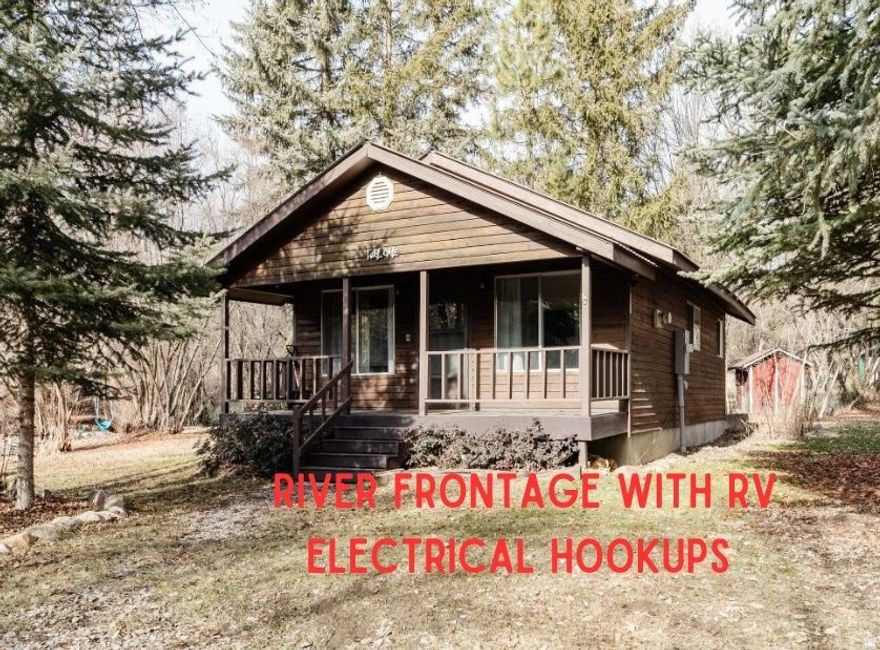 Escape to nature with this charming 1-bedroom/1-bath RIVERFRONT cabin nestled along the Cub River in a beautifully wooded setting. Designed for recreational use, this cozy retreat offers the perfect place to unplug and unwind while enjoying the sights and sounds of the river just steps away. Inside, you'll find granite countertops, durable LVP flooring throughout, an on-demand water heater, and a warm propane fireplace for year-round comfort. Ideal for weekend getaways, or a peaceful basecamp for outdoor adventures, this property delivers rustic charm with modern finishes in an unbeatable natural setting.