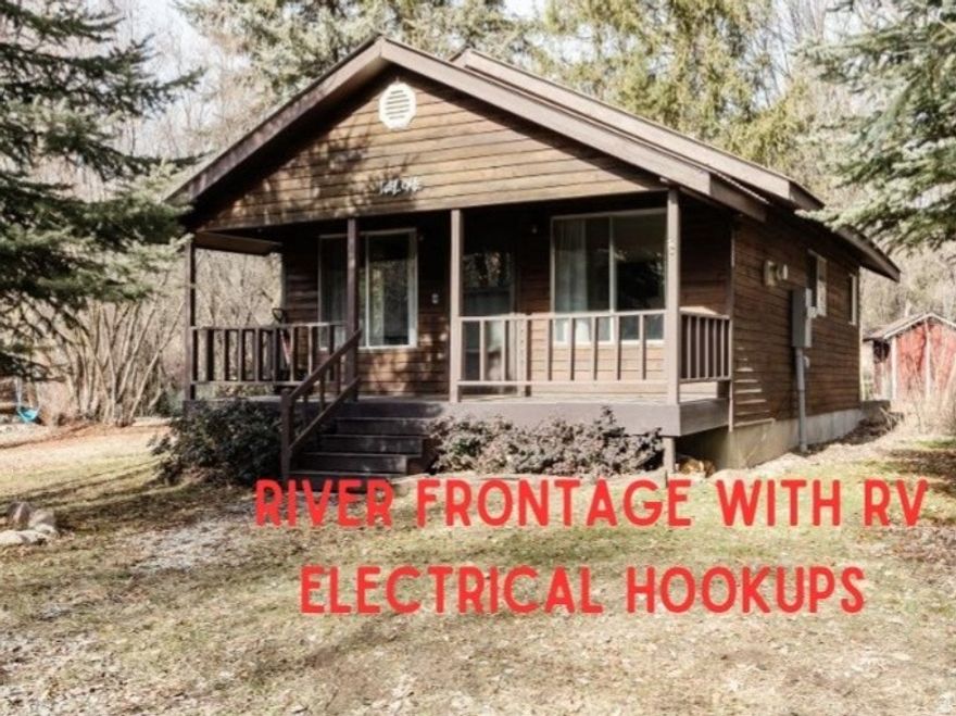 Escape to nature with this charming 1-bedroom/1-bath RIVERFRONT cabin nestled along the Cub River in a beautifully wooded setting. Designed for recreational use, this cozy retreat offers the perfect place to unplug and unwind while enjoying the sights and sounds of the river just steps away. Inside, you'll find granite countertops, durable LVP flooring throughout, an on-demand water heater, and a warm propane fireplace for year-round comfort. Ideal for weekend getaways, or a peaceful basecamp for outdoor adventures, this property delivers rustic charm with modern finishes in an unbeatable natural setting.