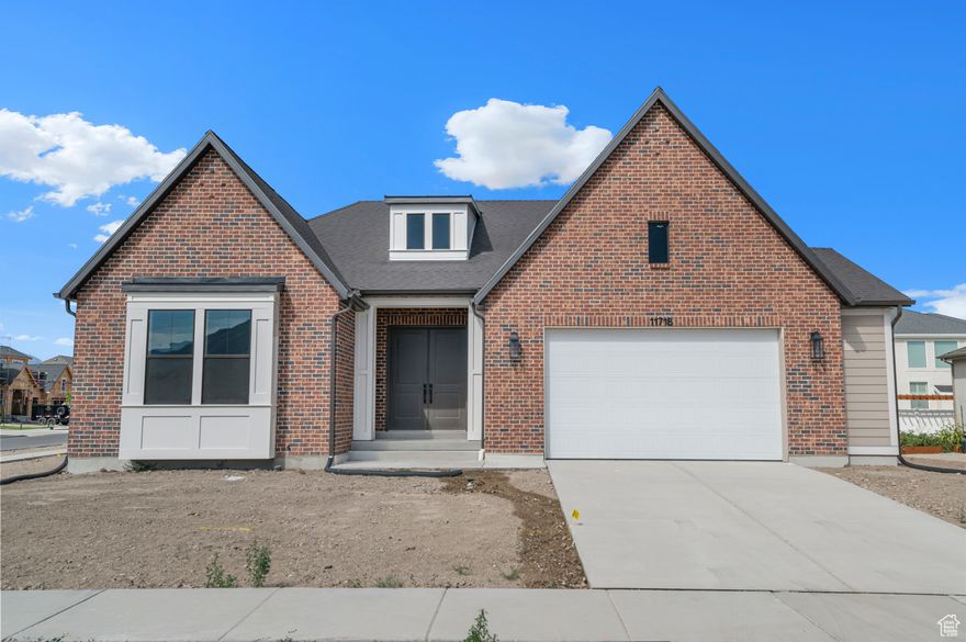 Stunning Raleigh Traditional home in a great Draper community! This home showcases elegant bluff maple cabinets with LED lighting, sleek quartz countertops, full height quartz backsplash and premium Caf stainless steel gas appliances, including double ovens. The open-concept layout features durable laminate hardwood, tile, and carpet flooring throughout. Enjoy 9-foot basement foundation walls and a fully finished basement for added space. The expanded 2-car garage, box window in the kitchen nook, and spacious covered deck with can lighting adds comfort and charm. Thoughtful touches include a gas log fireplace in the great room and gas lines for BBQ and dryer. Bathrooms feature stylish tile surrounds, while textured walls, two-tone paint, and bold black matte hardware elevate the overall design. Finished with Roosevelt-style base and casing for a refined touch. This is a must see!