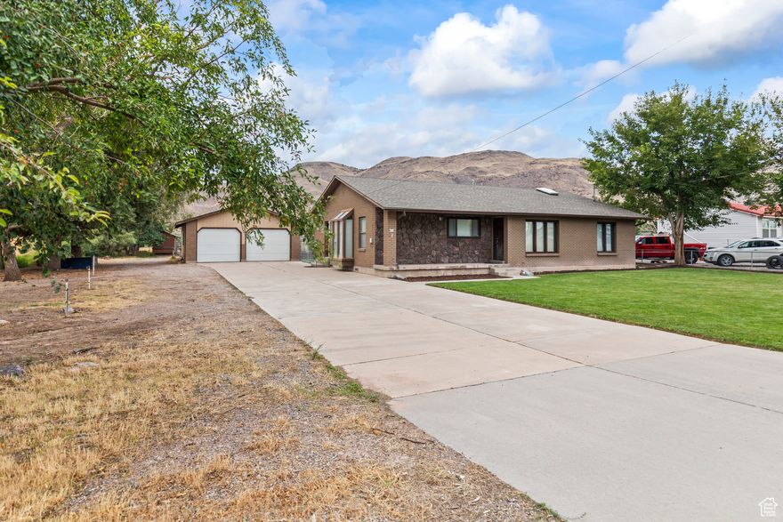 This peaceful 2 bed, 2 bath home sits on a spacious 0.5-acre lot in a quiet small town. Recently updated with a new roof, the property offers ample outdoor potential to plant fruit trees, raise chickens, or just enjoy the open space. Fenced back yard. A detached garage, plenty of parking, and a covered back porch add convenience and comfort. Bordered by a canal on one side and includes a water share. Don't miss out of this home! schedule a showing today.