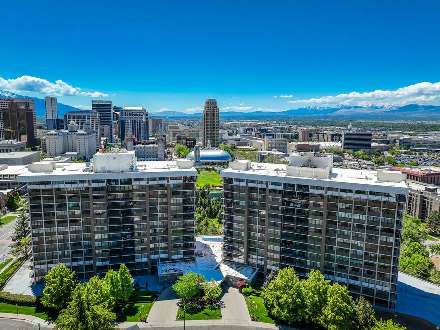 Fabulous highly sought after Penthouse in Zion's Summit High Rise Condominiums located in the heart of downtown Salt Lake City with spectacular views of the North Bench Foothills and the Capitol Building. This unit is one of the largest units rarely available with so many wonderful features including being conveniently located to all the downtown amenities, City Creek Shopping Center, Restaurants, Hiking and Biking Trails, (Bonneville Shoreline Trail), Theater, Symphony Hall, Salt Lake Temple not to mention Freeway Access and Airport.The tiled entry leads you into this open and spacious layout with plenty of natural sunlight through the huge picture windows and sliding glass doors leading out to a private deck. The west side deck provides sunny mornings and cool evening mountain breezes. The front room/dining room area features wainscot detail, oak built ins, crown moldings, gas fireplace with marble surround....all adding to the timeless charm of this living space.The condo features two oversized master suites including en suite bathrooms and walk in closets. One master bedroom has built in oak shelves, crown molding detail, double closets, a  tiled bath with shower only and a single vanity sink. The second master bedroom has crown moldings, tiled bathroom with a jacuzzi tub, (no shower) and a single vanity sink. The third bedroom with closet and window is an additional potential bedroom currently used as a den/office but could be used as a TV room/ exercise room or office and features a ceiling fan, oak detail and coffered ceilings. Hallway guest 3/4 bath has laminate floors and a single vanity. All three bedrooms have wonderful views and lots of natural light.Wonderful bright kitchen and adjoining kitchen eating area and breakfast bar. The kitchen has lots of storage and counter top space, ceiling fan, tiled counter tops, under counter lighting, tiled floors, walk in hallway pantry with built in shelving and stainless steel appliances. The tiled kitchen dining area also has a small closet for storage.Tiled Mud Room/Washer/Dryer Laundry area, tiled floors and a second access door to outside hallway.Other Special Features Include: 2 Car Heated Garage with Automatic Openers with Storage Unit, Elevator, Single Level Living, Central Air Conditioning, Gas Forced Air Furnace, Electric Dryer Hookups, Double Pane Windows, Outdoor Lighting, Carpet, Laminate and Tiled Floors, Electric Vehicle Charging, Microwave, Range, Refrigerator, Disposal and Dishwasher included, Full Landscaping with Mature Trees and Pines, Sidewalks and Mountain Views.