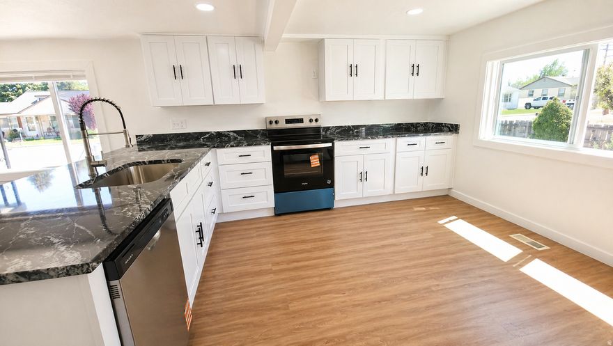 Beautiful 2-bedroom, 2-bath home in Grantsville with open-concept living and modern updates. Features new LVP flooring, brand-new carpet in bedrooms, fresh paint inside and out, recessed lighting, brand-new windows, and a brand-new kitchen with granite countertops and new appliances, plus an updated bathroom and ductless AC.  Roof is approximately 5 years old, with furnace and water heater replaced in 2017. The second bathroom is located in the utility basement, which also has a separate exterior entrance for added flexibility.  Includes a 2-car garage and 1 workshop, plus cellar below for extra storage. Yard is mostly fenced. Clean, move-in ready home with great usable space.