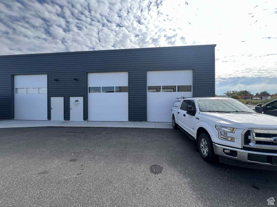 Located within the Slaterville Commercial Park, this industrial warehouse offers approximately 2,000 total square feet of space, perfectly suited for a variety of storage needs. The property is zoned Marriott-Slaterville City C-2P, ensuring compatibility with commercial operations. Featuring a large open warehouse layout and single-phase 110 power, it boasts impressive 18-foot ceiling clearance and 14-foot high by 12-foot wide overhead doors, allowing for easy movement of goods and equipment. Abundant natural light fills the space, creating a bright and inviting work area. The warehouse benefits from direct access to the freeway and major roads, providing convenient transportation and logistics advantages. Tenant improvements are negotiable, however no water is available.