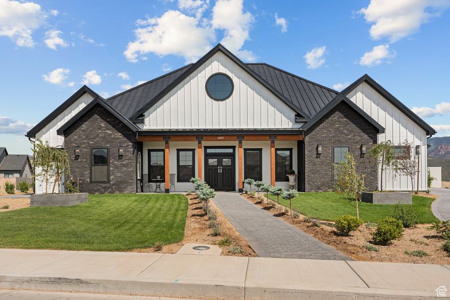 Welcome to your dream home in the highly sought-after Saddleback Ridge neighborhood of Cedar City, Utah. Perched on an elevated 0.49-acre lot, this exquisite custom residence offers breathtaking panoramic views-arguably the best Cedar City has to offer. Thoughtfully designed and impeccably crafted, this is not your average home. Step outside to a sprawling 500 sq. ft. patio, complete with elegant pavers, a built-in outdoor kitchen, and a wood-fired pizza oven-the ultimate space for entertaining or simply soaking in the sunset over the valley. The fully landscaped yard is a peaceful retreat, enhanced by a greenhouse complete with water hookups and power to provide heat in the winter and a dedicated storage shed for added convenience. Inside, the home features a spacious great room and kitchen area with vaulted ceilings, showcasing attention to detail at every turn. From crown moldings and oversized baseboards to built-in cabinetry and a hidden walk-in pantry, no element was overlooked. The kitchen is equipped with high-end appliances and top-of-the-line plumbing fixtures, ideal for those who love to cook and entertain. Finished with a durable and stylish metal roof, this home combines timeless beauty with low-maintenance living. Skip the stress and delays of building-this truly unique property is move-in ready and waiting for someone who appreciates craftsmanship and comfort.