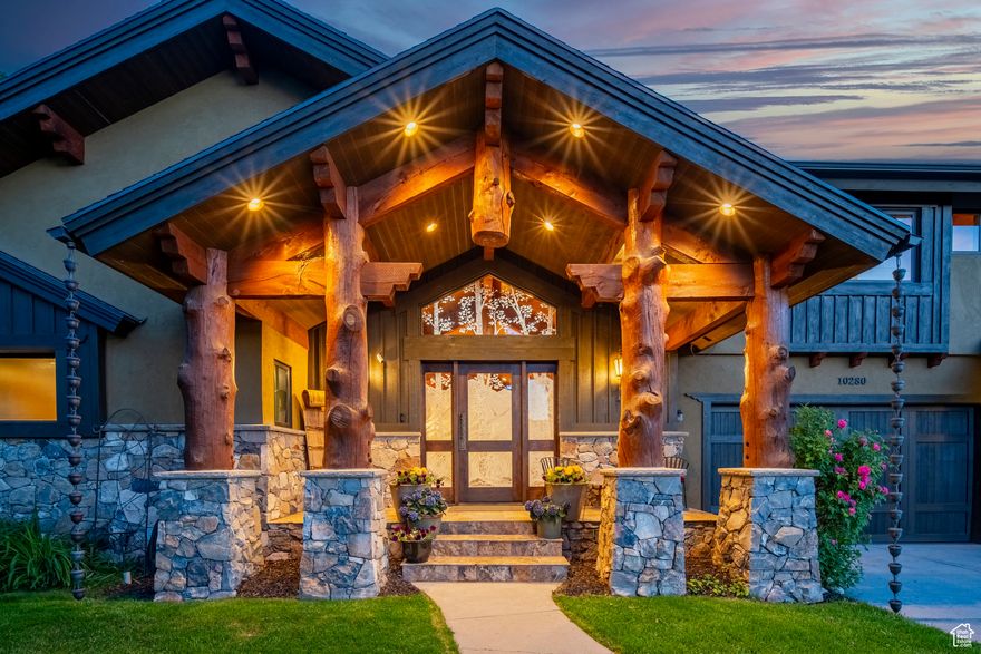 Discover luxury mountain living in this extraordinary, fully furnished estate on .68 acres on the upper east bench of Sandy. This is a custom home builder's personal home, located along scenic Dimple Dell Rd.  This 8000+ square-foot custom home, just 15 minutes to Snowbird/Alta, offers 6 bedrooms & 5.5 baths with unmatched Craftsmanship throughout. The chef's kitchen is a dream! Featuring Viking appliances built in fridge /freezer columns, a 48-inch range with griddle, a copper farmhouse sink, chiseled edge granite, and custom cabinetry. The expansive great room boasts a 24-foot disappearing glass wall that frames breathtaking mountain views and opens to a large covered patio perfect for entertaining. The primary suite on the main floor features a jetted tub, steam shower, and a large walk-in closet with laundry. The upper-level secondary suite is built under a striking timber steel structure and includes a sauna, hand-etched custom glass shower, and walk-in closet. The hand-scraped solid white oak floors, custom lighting, surround sound, and multiple entertaining areas enhance this home's inviting atmosphere. The finished basement includes a full kitchen, theater-ready rec room, wine cellar/cold storage, 3 guest bedrooms, and a walkout grotto. The home also includes two garages with space for 6 cars, a heated workshop, and RV boat storage. The fully landscaped backyard features a fresh mountain water pool that can be used for a natural cold plunge. It also has a hot tub, patio, garden shed, and zoned Irrigation using three shares of Bell Canyon water. Located just minutes from world-class skiing in Little and Big Cottonwood canyons, top-rated schools, and endless trails. This is a rare opportunity to own a custom mountain estate in one of Sandy's most scenic corridors. Square footage figures are provided as a courtesy estimate only and were obtained from an appraisal sketch. Buyer is advised to obtain an independent measurement.