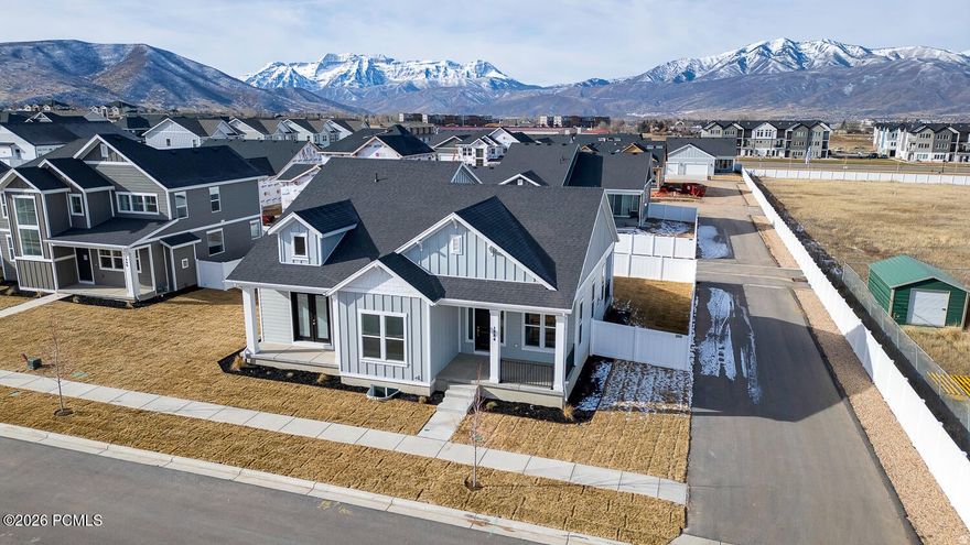 Sales Event! Receive $56,940 towards interest rate buy down and or closing costs with preferred lender. Refrigerator and window coverings also included!!!  Our beautiful Main floor living at its best. 10' ceilings on the main floor. ENORMOUS 3-car toy garage with extra height and 10'X10' opening. Enjoy the mountain views with 3 outdoor patio areas. The primary suite is a retreat with spa like bathroom and access from the primary closet into the laundry room. Taller ceilings in the basement offering a spacious family room, 1 bedroom and 1 bathroom.  Fully landscaped including a fenced backyard.  On one of the largest lots in the community.  Buyer to verify all.