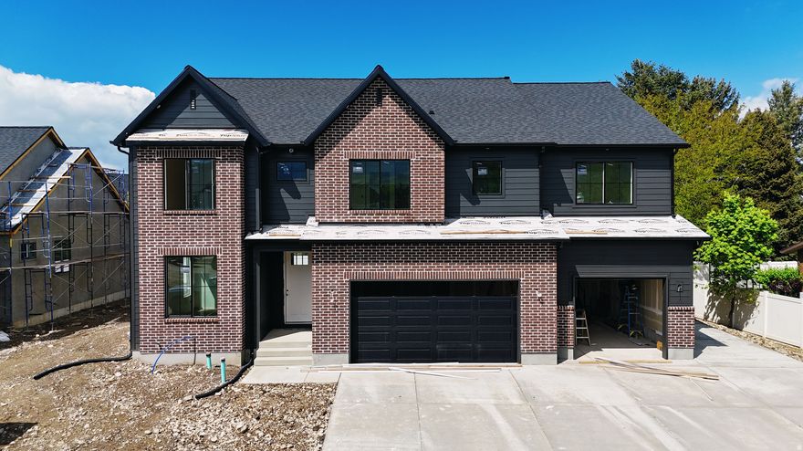 Belmont west neighborhood just south of 1600 N in Orem. This 2 story plan features a 2 story family, a spacious kitchen with a 36" free standing Cafe gas range and a butlers pantry. Built ins at the fireplace and Mudroom. The oversized primary bathroom and closet is sure to please. This one is loaded up with features you are sure to love. Scheduled for completion the first part of June. Call for more details.