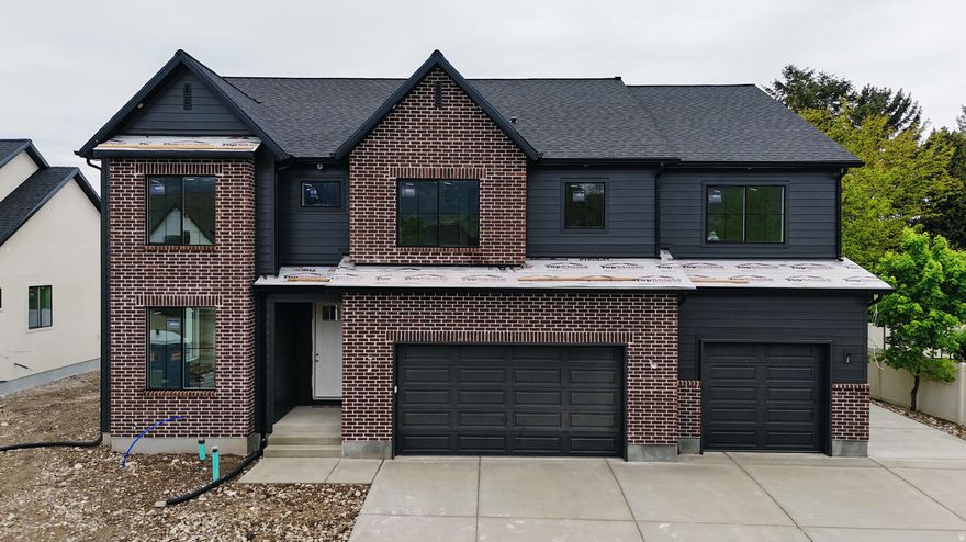 Belmont west neighborhood just south of 1600 N in Orem. This 2 story plan features a 2 story family, a spacious kitchen with a 36" free standing Cafe gas range and a butlers pantry. Built ins at the fireplace and Mudroom. The oversized primary bathroom and closet is sure to please. This one is loaded up with features you are sure to love. Scheduled for completion the first part of June. Call for more details.