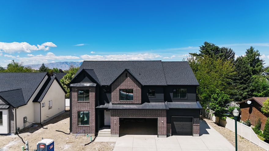 Belmont west neighborhood just south of 1600 N in Orem. This 2 story plan features a 2 story family, a spacious kitchen with a 36" free standing Cafe gas range and a butlers pantry. Built ins at the fireplace and Mudroom. The oversized primary bathroom and closet is sure to please. This one is loaded up with features you are sure to love. Scheduled for completion the first part of June. Call for more details.