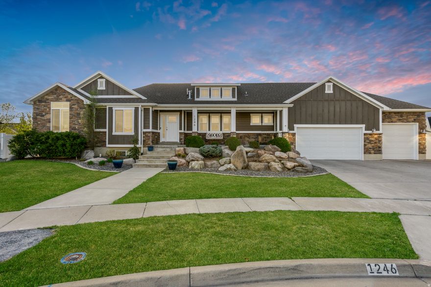 Welcome to Bridgeway Island, one of the area's most sought-after communities, known for its well-maintained homes, quiet streets, and strong sense of community. Enjoy access to the neighborhood pool and convenient proximity to Legacy Parkway for an easy commute.  This home offers incredible flexibility with mother-in-law or rental potential, featuring a basement already plumbed for a full kitchen and a walk-out entrance into the garage-perfect for separate living or income opportunities.  From the moment you arrive, the curb appeal shines with an expansive covered front porch-ideal for relaxing and enjoying the cul-de-sac. Inside, the custom floor plan impresses with an open-concept kitchen and great room, highlighted by vaulted ceilings, a cozy fireplace with custom trim, and an inviting layout perfect for entertaining.  The kitchen is a standout, complete with a custom tile backsplash, stainless steel appliances, and a vented range hood. The spacious primary suite features vaulted ceilings, a large walk-in closet, and a private en-suite bathroom with double vanity and separate tub and shower.  Downstairs, you'll find a massive second family room, abundant storage, and space ready for a future wet bar or full second kitchen-adding even more versatility to the home.  Step outside to enjoy the covered back patio and fully fenced, landscaped yard-perfect for gatherings, pets, or play. Bring all your toys with an oversized garage featuring a gas heater, plus a large RV parking pad for added convenience.  This home truly has it all-space, flexibility, and location in a highly desirable community.