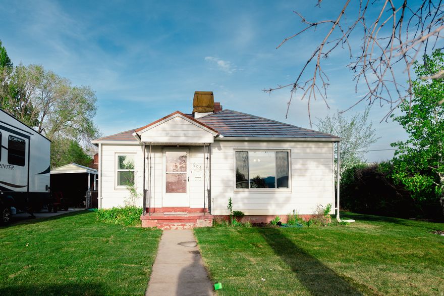 Cute bungalow on a tree lined street one block away from USU Eastern! If you are looking for large bright living rooms, hardwood floors, and a kitchen with a gas range this home is for you! This home has a 2 car detached garage, shed, RV parking and a metal roof!!!! Call and schedule a tour today! Square footage figures are provided as a courtesy estimate only. Buyer is advised to obtain an independent measurement.