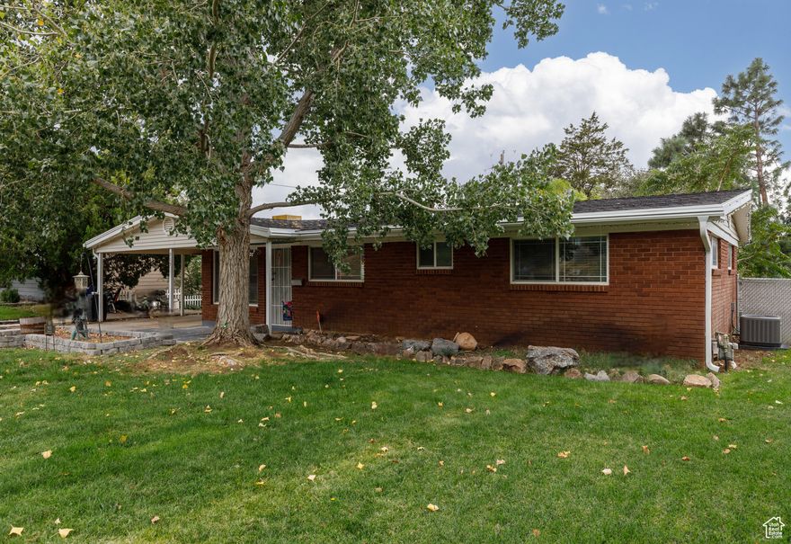 This home is the perfect blend of classic charm and modern updates! Tucked into Ogden's East Bench, 915 Hislop Drive is a 3-bedroom, 2-bath, 1,651 sq. ft. single level living rambler that has been thoughtfully remodeled inside and out. Originally built in 1954, the home has seen major upgrades in the last five years, including a brand-new AC, kitchen appliances, RO water in kitchen, Shed with power, updated interior plumbing, new fireplace insert, water heater, water softener, a spacious new deck with pergola, and leaf guard gutters. Inside, you'll find engineered hardwood floors, updated bathrooms, and a bright open-concept living space designed for gatherings. The oversized master bedroom features French doors leading to the backyard retreat. Step outside to enjoy your sunsets, mature landscaping, and two storage sheds - all with gorgeous mountain views from the front and sweeping vistas to the west. This home is move-in ready and offers the comfort of single-level living in a peaceful neighborhood.  The covered carport offers additional storage and parking for toys and vehicles.