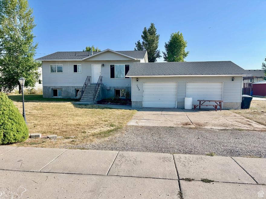 Home on Bigger City Lot! This home is for the DIY lovers out there and is being sold "As-Is". A lot of potential with this 2052 sqft rambler on .60 acre with plenty of space for parking trailers, RVs and toys. 4 bedrooms, 2 full baths, 2 family rooms, fireplace space, oversize 2 car garage with storage, outbuilding, garden plot, patio with pergola, and dog run.