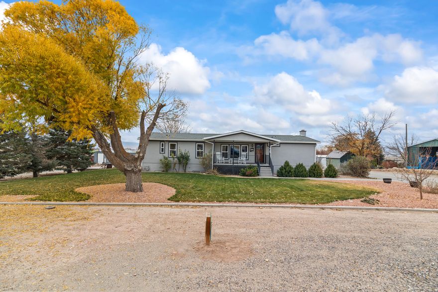 Updated home on acreage with views. Homesteader's dream! Leverage the space and utility of this property for almost any need or project. Stunning southward views over the valley and nearby creek. Ideal set-up for horses or other animals with corrals and a non-freeze, automatic livestock waterer. Pressurized irrigation included. Several outbuildings. Attached garage workshop. Wood stove in basement for a backup heat source. Turn-key home! Investment, Airbnb, and multi-generational living potential. 3D tour: https://my.matterport.com/show/?m=3EEcmfjRzPo