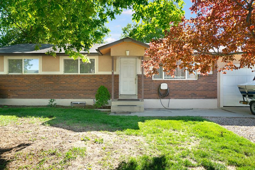Positioned for easy access to I-15, the hospital, and everyday essentials, this west-facing home sits on a .19-acre lot with space to actually use. The kitchen has been updated with granite counters, a gas range, and ample cabinetry. Basement windows have been replaced, bringing in better light and efficiency, and two bedrooms feature brand-new carpet. A fully fenced backyard. One of the biggest upgrades here isn't flashy: the plumbing from the home to the street replaced.