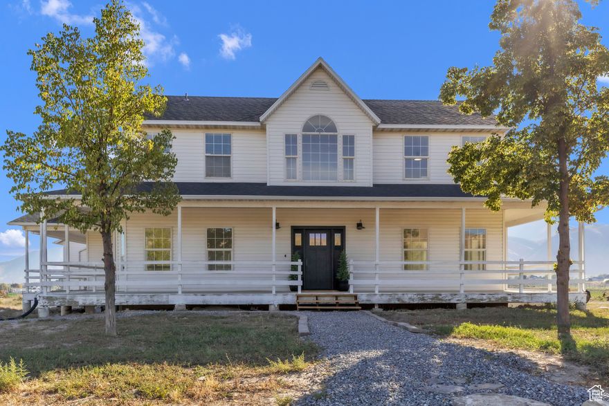 Dont Miss Out on This Rare Opportunity!  This incredible property offers 2 parcels sold together as one, totaling 7 acres and 14 shares of water. The home has been completely remodeled inside, with only the kitchen left to finish.  The spacious Master Suite includes a large bedroom, sitting area, oversized closet, and private bathroom. Step outside onto the master deck and take in endless views of green hay fields, mountains, and wide-open-skies, fresh country air that will make you want to stay forever.   The open floor plan fills the home with natural light and breathtaking views from every window. The basement features a large apartment with it's own private entrance, perfect for guests, rental income, or multi-generational living.   Out front you'll find 22 fruit trees, while the land behind the home is farmed in alfala, ideal for those who Love a rural lifestyle.  With 5.25 acres for the home plus an additional 1.75 acre parcel, this property is a true once in a lifetime opportunity. Dont let your dream home slip away.   Square footage figures are provided as a courtesy estimate only..  Buyer is advised to obtain an independent measurement.