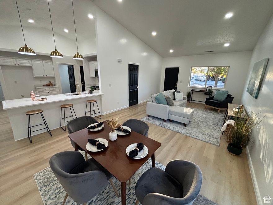 Welcome to 352 Sam Gates Rd in Ogden, UT! This unique, newly updated rambler offers nearly 2,000 sq ft all on one level with 4 bedrooms and 2 bathrooms. Step inside to find brand new LVP flooring throughout, plush new carpet in every bedroom, and an inviting open-concept kitchen and living area. The kitchen features quartz countertops, gold finishes, and soft-close cabinetry--perfect for entertaining or everyday living.  The luxurious master suite is a true retreat with a spa-like bath showcasing a separate tub and shower, plus a massive private walk-in closet. Outside, enjoy a fully fenced backyard--ideal for pets, gatherings, or quiet evenings at home. The oversized 2-stall garage and extended driveway provide ample parking and storage.  Nestled in a quiet, modern neighborhood with wonderful neighbors, this home combines peace, comfort, and style. Homes like this don't last long--schedule your showing today!