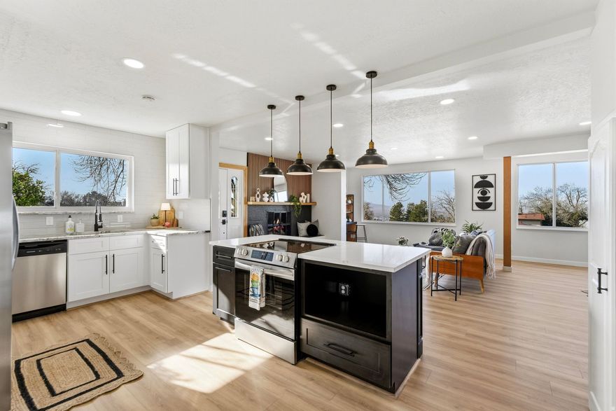 Come home to this wonderful neighborhood that is walking distance from schools, parks, trails, and churches as well as just 15 minutes from Salt Lake City. This stunning home is situated on a corner lot and has been wonderfully updated throughout. When you first walk in you will notice the wide-open space of the living room, dining room and beautiful kitchen. The living room has a custom fireplace and large picture windows so you can relax and enjoy the spectacular views of the Valley, the mountain and nightly sunsets. The primary en-suite features a double vanity, storage shelves and is beautifully tiled. The basement has two large bedrooms with huge walk-in closets plus spacious and thoughtfully designed laundry room, a family room and a full bathroom. The outdoor space is fully fenced and perfect for entertaining. Square footage figures are provided as a courtesy estimate only and were obtained from County Records.  Buyer is advised to obtain an independent measurement.