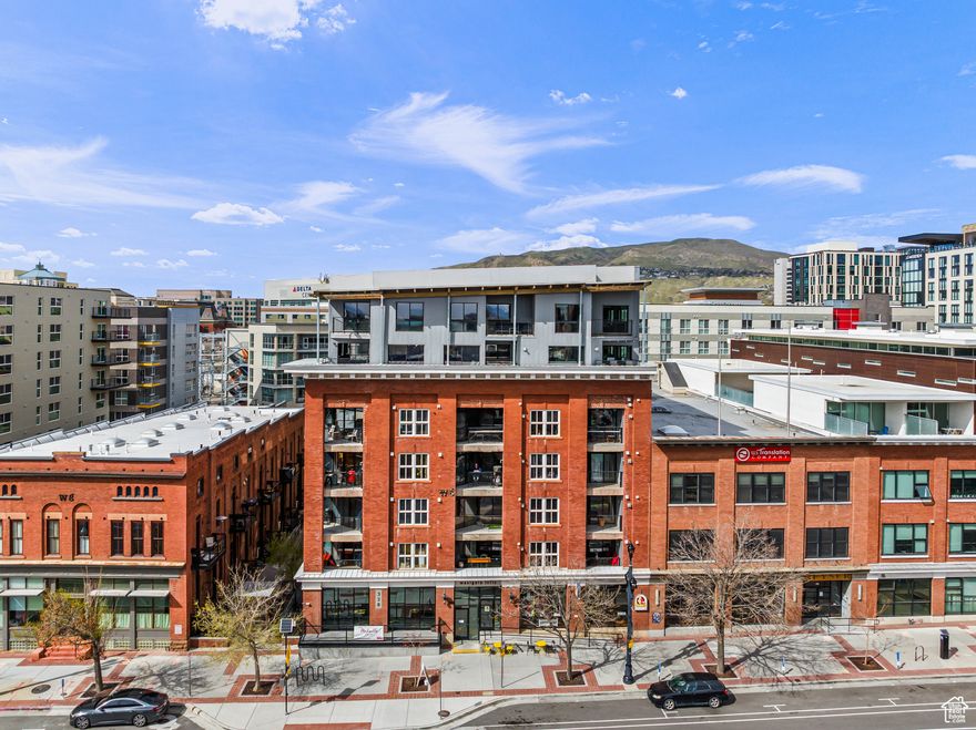 Stylish and versatile condo in Westgate Lofts in Salt Lake City, a historic downtown building built in 1910. This 2-bedroom, 2-bathroom residence blends post-industrial aesthetics with modern finishes. Soaring ceilings, exposed beams, and an open-concept living space define the home's character. Originally planned as two units, but created into one expansive residence, it has recently been claimed back as two parcels with two unit numbers -offering rare investment potential. Features include two balconies, two parking spaces, two storage units, and expansive city views. Dog-friendly, sold mostly furnished, with furniture list provided. Located just steps from Salt Lake City's best restaurants, bars, and entertainment venues.