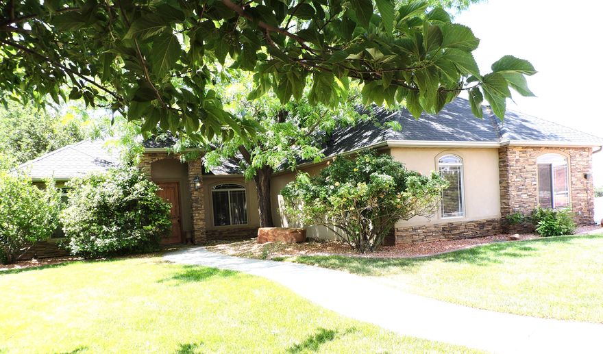 If you've been looking for a large home and plenty of room to store your outdoor toys, vehicles, RV, boat, tractors, tools, etc. then you need to come tour this gorgeous one-level custom built 3163 Sq Ft Home on 1.22 acres. This home has 4 Guest Bedrooms, 2 full guest bathrooms, 1 Master Suite with a large En-suite bathroom, and a large walk-in/walk-thru closet. Enjoy a little privacy with 3 of the 4 guest bedrooms being located on the other side of the home. It also has a large laundry room, walk-in pantry, wood burning fireplace in the family room, propane fireplace in the living room. Includes an on-demand Generac generator, patio hot tub, large garden shed, 4 raised bed garden planters with drip system. PLUS, a HUGE 4224 Sq Ft Shop with  bathroom, as well as a 50-amp RV hookup and dump station. If you have horses no worries...there is room to install corrals for them too. The home is shaded by lots of mature trees and surrounded by fully landscaped front (with a rock waterfall) and back yard. All driveways around the property are either concrete or fully graveled. All of this and it's even located in a quiet neighborhood!! Short drive to 5 National Parks. Buyer to verify all.