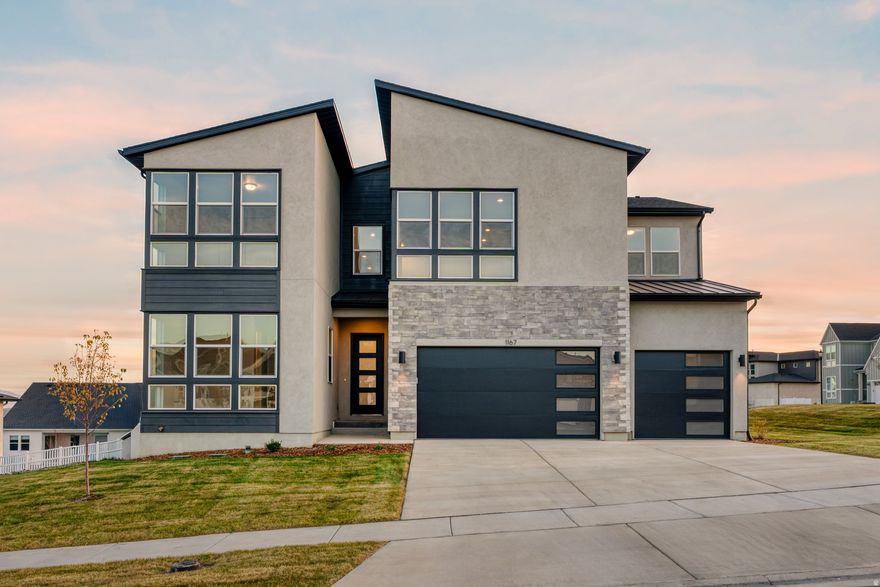 Perched atop the community, this stunning Tuscarora Mountain Modern home combines chic design with breathtaking views. Take in spectacular mountain and lake vistas from your covered backyard deck. Inside, a dramatic two-story great room showcases soaring 20-foot ceilings and a sleek modern linear fireplace. The kitchen impresses with 10-foot ceilings, abundant cabinetry, a waterfall island, gold accents and a gas cooktop. Thoughtful design continues throughout, featuring 8-foot doors, a spacious second-floor loft, and en-suite bathrooms in three of the four bedrooms. A three-car garage and an unfinished basement-pre-plumbed for a future kitchen-offer endless possibilities.