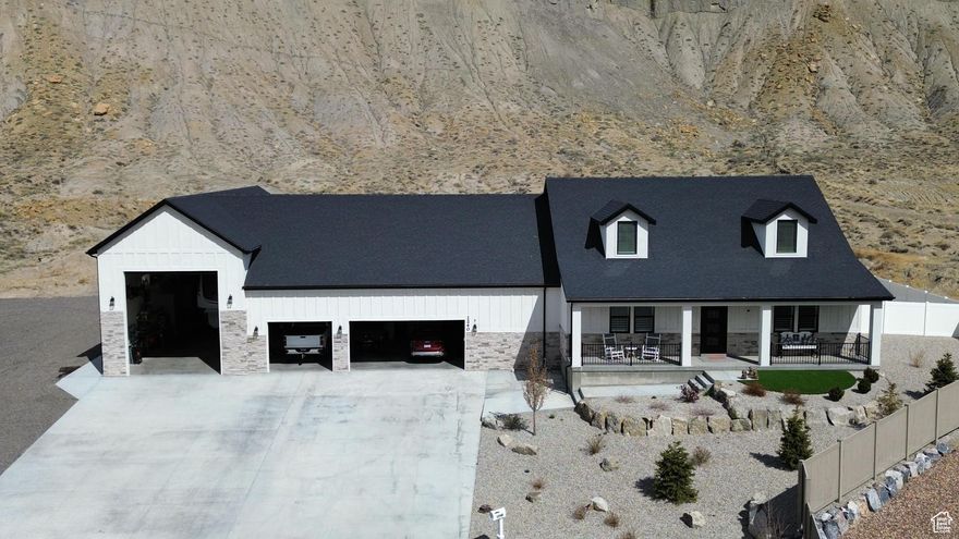 It's not often that a custom home like this comes on the market! From the moment you walk through the front door, you're greeted by the fresh scent of new construction and an atmosphere of quality craftsmanship.  The entryway is filled with natural light and features stylish, on-trend lighting. Just off the entry is a spacious front office or bedroom-much larger than a standard bedroom, offering flexibility for your lifestyle needs.  The open-concept living room boasts custom cabinetry, a cozy fireplace, and expansive windows that perfectly frame the breathtaking cliffs of Carbonville. The kitchen is a true showstopper, offering generous countertop space ideal for entertaining, a walk-in pantry with a built-in butcher block for food prep or storage, and custom window shutters throughout the home that add a touch of elegance and functionality. Each room is thoughtfully designed to adapt to the variety of lifestyles and needs, offering more flexibility and functionality than a traditional home.   Additional features include:  Two central air units and two furnaces for efficient comfort  An impressive 20x60 RV garage with built-in custom cabinets and a bench that will remain with the home  A backup generator for peace of mind  Raised garden boxes, each equipped with a drip irrigation system  Programmable trim lighting for year-round curb appeal  Exterior side parking with durable road millings  The sellers are thrilled to share their home with prospective buyers, but respectfully request a pre-approval letter prior to scheduling a private showing.   Square footage figures are provided as a courtesy estimate only and were obtained from Carbon County .  Buyer is advised to obtain an independent measurement.