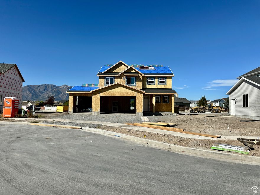 The Briarwood floor plan, a two-story home with 3-car garage located in Nibley's Firefly Estates Community. Main level offers 9' ceilings, an open floor plan with luxury vinyl plank flooring throughout. The kitchen features quartz countertops, large stainless steel sink, white, ceiling height cabinets with a charcoal stained wood island. Upstairs, you'll find all bedrooms conveniently placed with laundry room nearby. The owner's suite includes tray ceiling, spacious walk-in closet and beautiful bathroom with separate tub/shower. *some photos are of a similar home with the same floor plan, but different color selections.* Estimated Completion: December 4, 2025