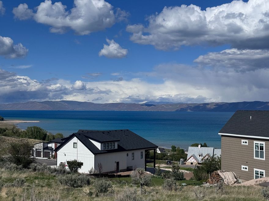 This amazing lake view lot in Cherimoya Hills offers stunning views overlooking the beautiful Bear Lake. The property features paved roads and utilities already stubbed, making it ready for your dream home. Nightly rentals are allowed, providing excellent investment potential. You can enjoy direct access to Hodges Canyon Trailhead without the need to trailer your vehicle, leading you to The Sinks and Cache National Forest for outdoor adventures. Just five minutes away is Bear Lake State Park Marina, perfect for water activities, and Beaver Mountain Ski Resort is only twenty minutes from the lot, offering year-round recreation. Whether you're looking for a permanent residence, a vacation getaway, or a wise investment, this location has everything you need to create your ideal lifestyle.