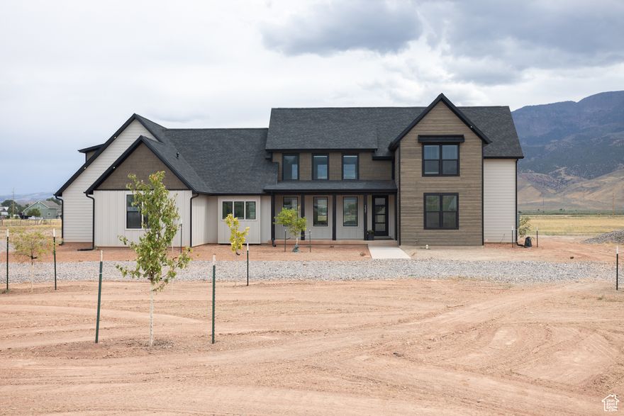 Modern Country Living on 3 Acres in Elsinore  Nearly new and thoughtfully designed, this 2-year-old home combines luxury finishes with the charm of rural living. Set on 3 acres with its own 1.5-acre water well and 3 shares of Brooklyn Canal Water, the property is both beautiful and practical. Inside, you'll find vaulted ceilings, quartz countertops, premium BEKO appliances, and an encapsulated crawl space with dehumidifier for year-round efficiency. The master suite offers dual closets, a euro-glass shower, and private laundry access-plus a nostalgic laundry chute that kids (and adults) will love. Enjoy a bonus room wired for a projector, a large safe room, and a versatile office/den. The oversized finished garage features extra depth, insulated doors, well controls, and a handy Costco pantry door. Comfort is ensured with dual AC, a mini split upstairs, and a saltwater softener. This property delivers the best of both worlds-modern convenience and wide-open country living under the Utah sky. (Home is in Elsinore - the Address was not working for the map unless we put Monroe -It's on the border.  Buyer to verify all info