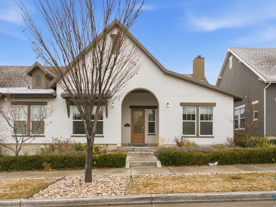 Enjoy all the upgrades and features that you would expect of this former model home: vaulted ceilings, extra canned lighting fixtures, designer paint with accents, designer interior doors, full window curtains and coverings, all cabinets and drawers are soft closing, built-in credenza in living room, Bose sound system with speakers in all rooms, built in security system. Kitchen extras include extra-large granite stone island, designer light fixture, farm sink, upgraded appliances, large pantry. Master bedroom and bath: cove ceiling, fully tiled walk-in shower, large walk-in closet. Separate large laundry room - washer and dryer included! Large garage with built in storage rack. Separate utility room off garage (not in living space or attic). Tankless water heater. Water softener included. Large covered and protected patio. Two built-in planters with decorative privacy screen. Property is Xeriscaped with rock (not mulch). Decorative outdoor fountain by alley. Outdoor lighting and some indoor lighting programmable with Alexa. Common wall provides quiet living throughout home. (All information deemed correct, Buyer and Buyers Agent to Verify)