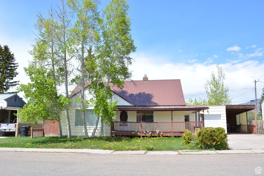 TUCKED BEHIND MATURE TREES, full covered front deck shades the sun. Walk into a spacious formal living room, kitchen has a breakfast bar, newer appliances, natural sunlight. The Master bedroom has plenty of room for that king bedroom set. The second bedroom on the main floor was converted to a dining room, which easily could be diverted back to a bedroom. A huge fireplace greets the guests into the family/game room. sliding glass doors out to a covered walkway and the private backyard. Garden shed, enclosed patio, and a second private enclosed patio/green house. The siding on the patios can easily be taken down to allow for cool evening breezes. Upstairs is a full bathroom, bedroom, TV /office room, and a reading nook. A New furnace was installed this spring. Put this home on your list and don't miss out!