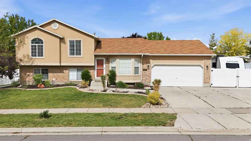 Beautifully updated multi-level home situated on a quiet cul-de-sac corner lot in a highly convenient Layton location. Thoughtful upgrades throughout offer both style and peace of mind, including a new furnace and A/C (2024), new carpet (2026), updated tile flooring, and modern lighting and fixtures. The kitchen has been refreshed with quartz countertops, stainless steel appliances, a gas range, and a stylish backsplash, creating a functional and inviting space. The spacious primary suite features a fully remodeled bathroom (2024) with a jetted tub, separate shower, and updated finishes. Additional interior highlights include upgraded railing, improved lighting, and a finished basement offering flexible living space. Step outside to a fully fenced backyard designed for both relaxation and utility, featuring an oversized deck, mature landscaping, garden area, storage shed, and RV parking. Enjoy established fruit and garden features, including honeycrisp apple trees, blackberries, and grapevines. Located near Hill Air Force Base, parks, and everyday amenities, with convenient access to shopping, dining, and commuter routes.