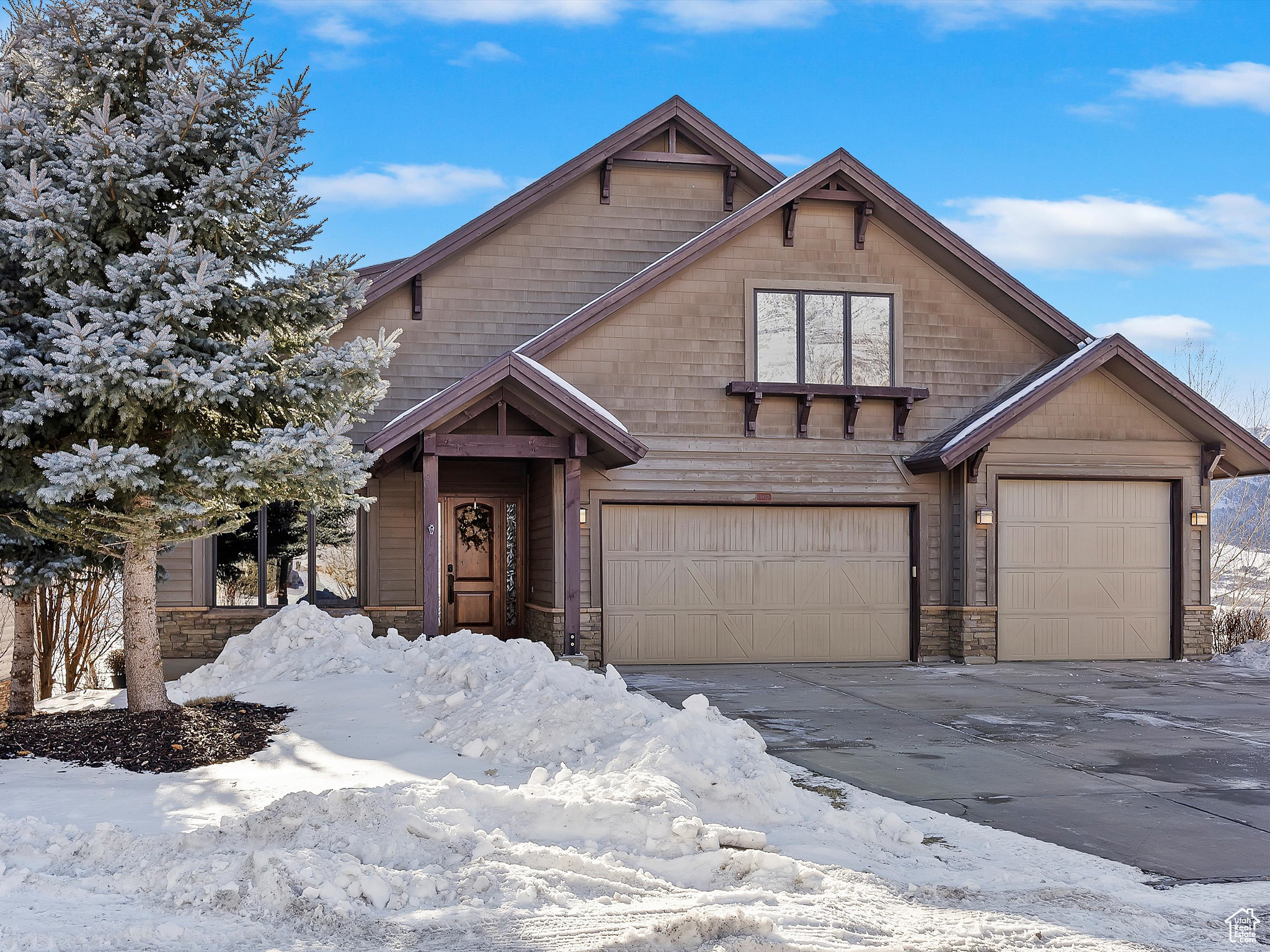 This Trappers Ridge gem underpromises and over-delivers! Surprisingly modest from the street the wow factors just keep coming once you cross the threshold of this unique beauty!Situated on one of the best lots in the community, adjacent to open space,this extraordinary home offersunmatched luxury, comfort, and breathtaking panoramic views ofNordic Valley, Pineview Reservoir, Ben Lomond Peak, and Snowbasin. The home boasts one of the largest and most open floor plans in the neighborhood, featuring expansive living and dining areas, a built-in bar, a stone gas fireplace, and a custom-painted antique white kitchen. Designed for both hosting and everyday living, the entertainer's kitchen includes a Wolf range, two Asko dishwashers, a Sub-Zero refrigerator/freezer, a copper farmhouse sink, an expansive island, and an ice maker. A wet bar with a Sub-Zero under-counter refrigerator/freezer and ice maker adds further convenience. The home is equipped with two hot water heaters with recirculation for instant hot water, ensuring comfort and efficiency.The main flooralsoincludes an en-suite bedroom and an enormous laundry room complete with alder built-ins, a tub sink, and an island. Upstairs, the luxurious primary suite features two walk-in closets with built-ins and two skylights that bathe the space in natural light.Two additional bedrooms provide ample space for family or guests, each thoughtfully designed with comfort in mind. The office, complete with custom built-ins and a sleek granite slab workspace, creates the perfect setting for productivity or creative pursuits.This level seamlessly blends practicality with luxury, making it a true retreat within the home. The walkout basementoffers additional living space with akitchenette, a pool table, a third en-suite bedroom with a walk-in closet, two additional bedrooms, ample storage, and a commercial projector in the spacious theater room, creating the ultimate entertainment space. Thegym room could also be used as an owner lockout, adding flexibility and privacy for homeowners or potential renters. The home boasts three separate gathering areas-one on each level-providing plenty of space to relax and unwind. Outdoor living is elevated with the largestcustomdeck in the neighborhood-an 888-square-foot space perfect for taking in the breathtaking surroundings. The hot tubbelowisideallypositioned for soaking while enjoying the panoramic views creating a truly tranquil retreat. Mature landscaping enhances the curb appeal, while modern amenities-such as two AC units and two furnaces with independent temperature controls for the basement and upstairs-ensure year-round comfort. Additional premium finishes include a central vacuum system, solid core doors, unique granite countertops throughout, and freshly refinished one-inch-thick wide-plank pine floors. The home was repainted in 2023 for a fresh, updated look. Trappers Ridge offers outstanding community amenities, including a clubhouse, swimming pool, hot tub, tennis courts, and the convenience of a lock-and-leave lifestyle. One of the few developments in the area zoned for nightly rentals, this home presents an excellent investment opportunity. Ideally located just minutes from Powder Mountain and Snowbasin, as well as hiking, biking, and water activities, this property offers unparalleled access to world-class outdoor recreation. With its spacious yet cozy layout, high-end finishes, and unbeatable location, this home is perfect as a primary residence, second home, or income-generating investment. All property information, boundaries and documents to be verified by buyer.