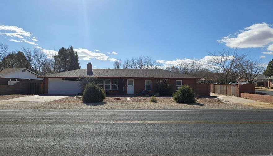 New AC, New Flooring. Lowest priced home on over a 1/4 acre in Greater St George. Fully fenced yard, extra driveway for RVs, easy ADU access, carport, two storage sheds, complete landscaping. Schedule a showing today!