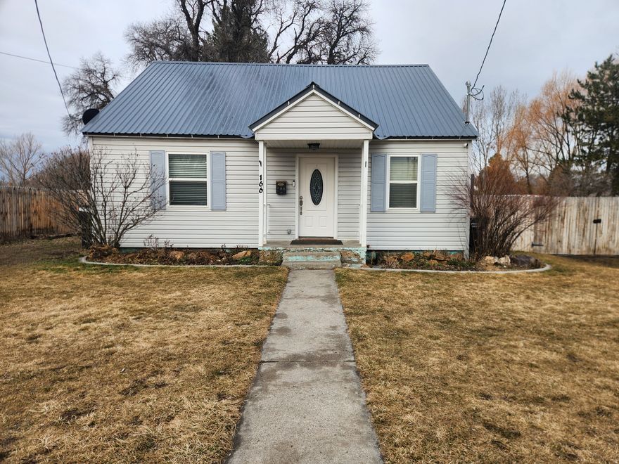 Come check out this cute 3 bedroom house in a great location. If you like living in town but need a little elbow room- this house is for you. A  0.6 acre lot with a huge backyard to spread out, garden, have animals- you name it. The home has great updates like a newer furnace, vinyl windows, a metal roof and vinyl siding. Clean and ready to move into. Call the listing agent to see this today.