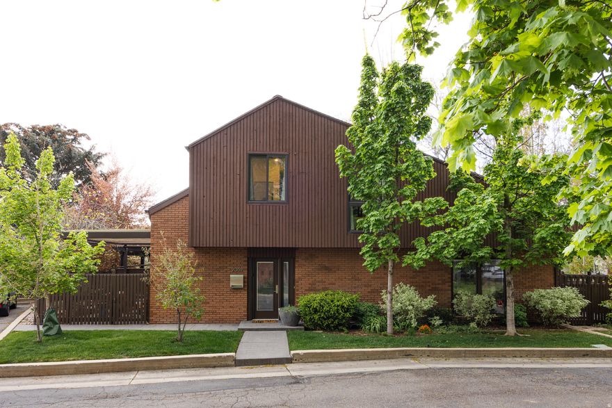 Properties in the Harvard & Yale neighborhood don't come up too often, and this is no coincidence. Those who live in the area tend to stay, as the location is convenient, the streets are tree-lined and quiet, and there's an idyllic feeling that permeates. This townhome on Michigan Ave. is worth a second look for more than just the area, however. Mid-century in sensibility, modern in execution, and maintained with a high standard, all three levels here have been remodeled to perfection and designed to accommodate. The main floor layout is intuitive and ideal for entertaining: the kitchen is seamlessly connected to the living/dining room-which has a fireplace and vaulted ceilings that give the room genuine scale-and to a flex space that currently serves as a bar/library. Two private patios that sit on each side of the property (one slightly larger and covered for warm evenings with a cool drink) make the outdoor space here feel considered rather than incidental. Upstairs, the primary suite is open and smart, with a large bathroom, oversized closet with in-unit laundry, and another space for WFH options. The lower level rounds things out with two additional bedrooms (one that's perfect for cozy movie nights, if you prefer to use it as such), another bathroom, and ample storage space. This property is ideally located, to say the least, and residents here can easily access the university, Emigration Canyon, I-80 and I-215, and a plethora of local dining and shopping options, both along Foothill and in the 15th & 15th area. Bonus: this unit comes with a one-car garage and an additional dedicated, uncovered spot. All in, a rare opportunity in a neighborhood that knows it.