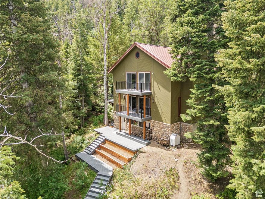 MOTIVATED SELLER.  - Just over  acre in Summit Park - Conveniently located between Park City and Salt Lake City  - Open, functional layout with large windows and abundant natural light - Kitchen remodeled (3 years ago) - new countertops and sink - Main floor bathroom remodeled - Brand-new carpet throughout (excluding lower level) - Detached two-car garage with: 240V EV charging outlet Water softener system Overhead storage - Parking for 4 additional vehicles - New 3-tier balcony and reinforced Trex front deck with heavy-duty support beams - Gas line on main deck for fire pit or grill - Surrounded by trees and wildlife - Trails and backcountry access right outside your door . Square footage figures are provided as a courtesy estimate only and were obtained from County Records . Buyer is advised to obtain an independent measurement.