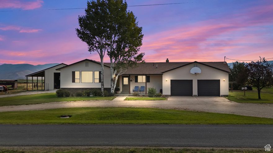 Escape to a quiet country setting with everything you need for the perfect rural lifestyle. This modest, charming home sits on a spacious 5.89-acre lot and comes with the invaluable asset of 5 shares of irrigation water, ensuring you'll maintain your great pasture.  The home offers a comfortable floor plan with 4 bedrooms and 2.5 bathrooms, and two family rooms for flexible living.  For the outdoor enthusiast, this is a dream! It's an ideal horse property, and the included 24'x40' insulated shop provides ample space for hobbies, equipment storage, or a workshop. You'll enjoy stunning mountain views and easy access to local recreation-you're just minutes from mountain trails, and nearby reservoirs offer excellent fishing and water-skiing opportunities.  Combine practical acreage with a comfortable home and unbeatable location. This property is perfect for anyone seeking peace, space, and a true connection to nature.  Buyer to verify all information.