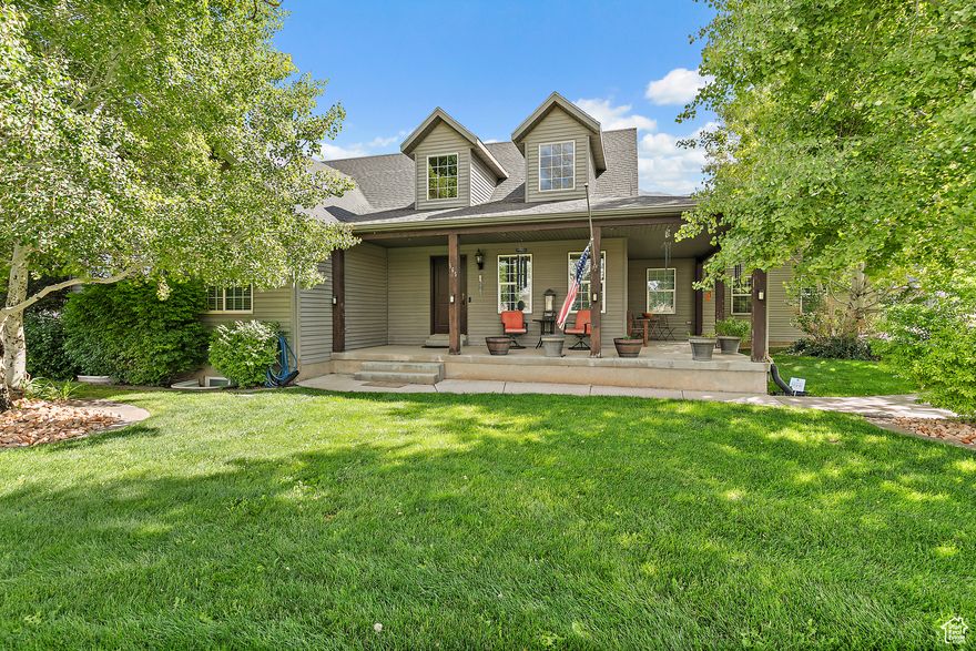 Discover this one-of-a-kind property in the heart of charming Mona, set on 1.5 acres with room for both family and animals. This spacious 5-bedroom, 3-bath home blends comfort, character, and functionality with timeless country charm. Step inside to an open-concept main living area and a bright, fully finished basement complete with a custom built-in desk, a cozy library nook, a wood-burning fireplace, and brand-new carpet.  The property offers an impressive list of extras:  *NEW ROOF INSTALLED 9/26/25*  A fully insulated 30'x40' outbuilding with ample power and lighting-ideal for storing toys or tackling big projects.  A 40' airtight shipping container (9' high) with power, set on a concrete foundation.  A 16'x16' insulated shed with power.  Garage outfitted with a full airline system and a 60-gallon hardwired compressor, and a Dedicated 40-amp EV charger.  Perfect for animal lovers, this property provides ample space for livestock with full animal rights, perimeter fencing, and plenty of shaded areas beneath nearly 100 mature trees. This home is truly a rare find, offering the peace of small-town living with the space, flexibility, and modern conveniences you've been searching for. Square footage and property details to be verified by buyer.