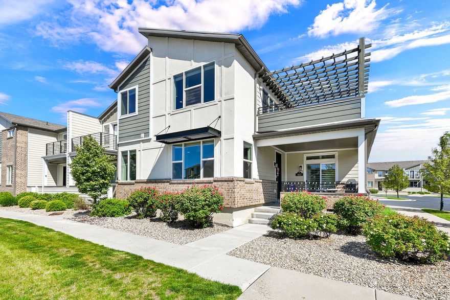 Location, comfort, and stress-free living! This coveted two-story townhouse end unit in Avenues at the Station is the 2366 sq. ft. Griffeth home plan. Uniquely designed with the Primary Suite on the main floor, along with the main kitchen, large living room, and a half bath. The upper floor opens to an expansive great room including a "party kitchen" and a 13'x12' deck for relaxation and entertaining! Two additional large bedrooms, with a full bath, and laundry, complete the space. There is an Option to add a laundry hookup on the main floor for anyone who has one level living desires.  This home has the best lot in the subdivision, nestled near the guest parking lot and community pool. There is a greater distance from all the other homes, which offers extra privacy and stunning mountain views year-round. Just step out your door, the options are endless! Take a walk or cycle on the Denver and Rio Grande Western (D&RGW) Rail Trail, part of a 100-mile connecting trail system extending from Ogden to Provo! Or, enjoy Station Park's shopping, theater, and restaurants, University Health Center, and the Frontrunner. Less than 1 mile from Lagoon amusement park  you can walk or take a free shuttle available at Station Park. Your large private entry porch is plumbed with a gas line for your grill, and plenty of space for a picnic and BBQ. The Primary suite on the main floor has custom plantation shutters and its own private access to the front porch. The ensuite bathroom has a spacious walk-in closet and includes a GFI plug next to the toilet for a bidet seat. The main floor has engineered hardwood flooring and 9-foot ceilings. The large second-floor east-facing deck is shady in summer and, combined with the great room, creates an expanded entertainment space for your family and friends. New ceiling fans [2022], New paint [2024], New appliances [2025], Custom blinds throughout the home, Soft close cabinetry in the main kitchen and primary suite, Garage has epoxy floor coating, extra bright lighting, and ceiling-mounted storage shelves