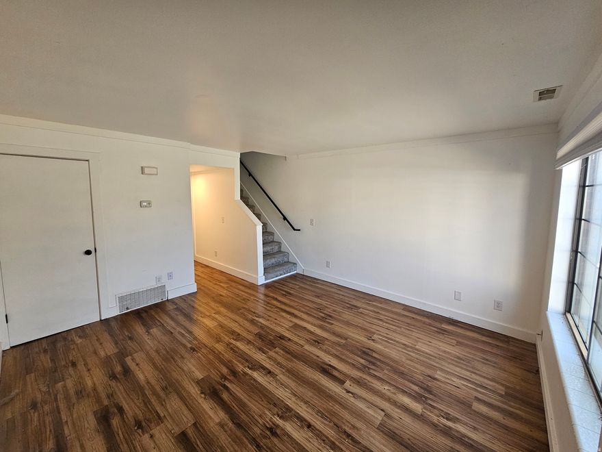 Updated and move-in ready! This sunny, bright townhome features a  kitchen with sleek cabinets and beautiful quartz countertops. Enjoy low-maintenance living with a functional layout and comfortable living spaces. Located right across from the golf course and just minutes from downtown Salt Lake City, Trax, and major bus lines, this home offers both convenience and charm. The pet-friendly community includes its own dog park, ideal for animal lovers, and you'll love the peace and privacy of your own private back patio. Additional perks include a covered carport, extra parking right out front, and a handy storage unit. A great opportunity for first-time buyers, investors, or anyone looking for easy living in a great location! Seller offering 1/0 rate buydown with preferred lender 5.321% first-year rate available. Contact agent for details.