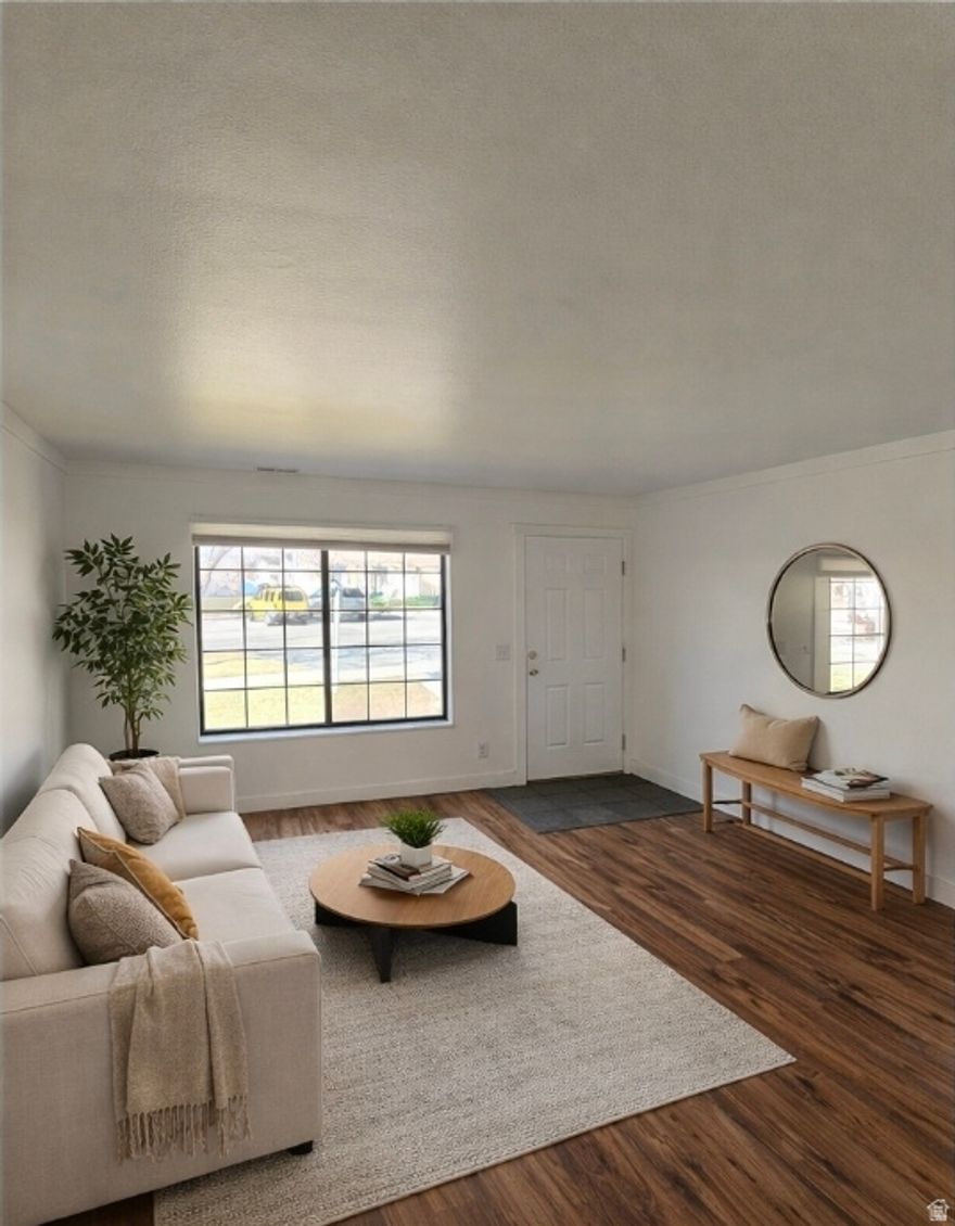 Updated and move-in ready! This sunny, bright townhome features a  kitchen with sleek cabinets and beautiful quartz countertops. Enjoy low-maintenance living with a functional layout and comfortable living spaces. Located right across from the golf course and just minutes from downtown Salt Lake City, Trax, and major bus lines, this home offers both convenience and charm. The pet-friendly community includes its own dog park, ideal for animal lovers, and you'll love the peace and privacy of your own private back patio. Additional perks include a covered carport, extra parking right out front, and a handy storage unit. A great opportunity for first-time buyers, investors, or anyone looking for easy living in a great location! Seller offering 1/0 rate buydown with preferred lender 5.321% first-year rate available. Contact agent for details.